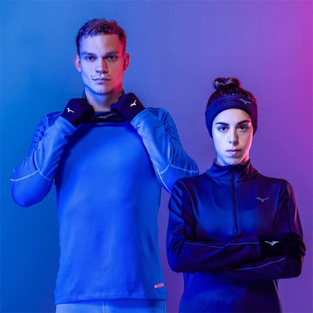 Man and woman with mizuno clothes and headbands in blue purple background