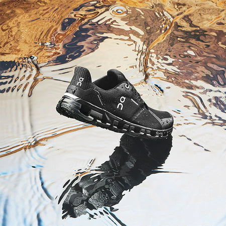 Black on shoe on water