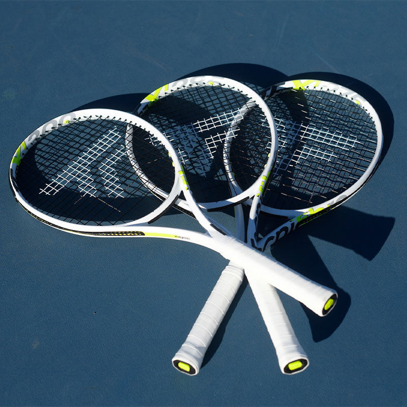 Three Tecnifibre tennis racquets splayed out on a blue tennis court.